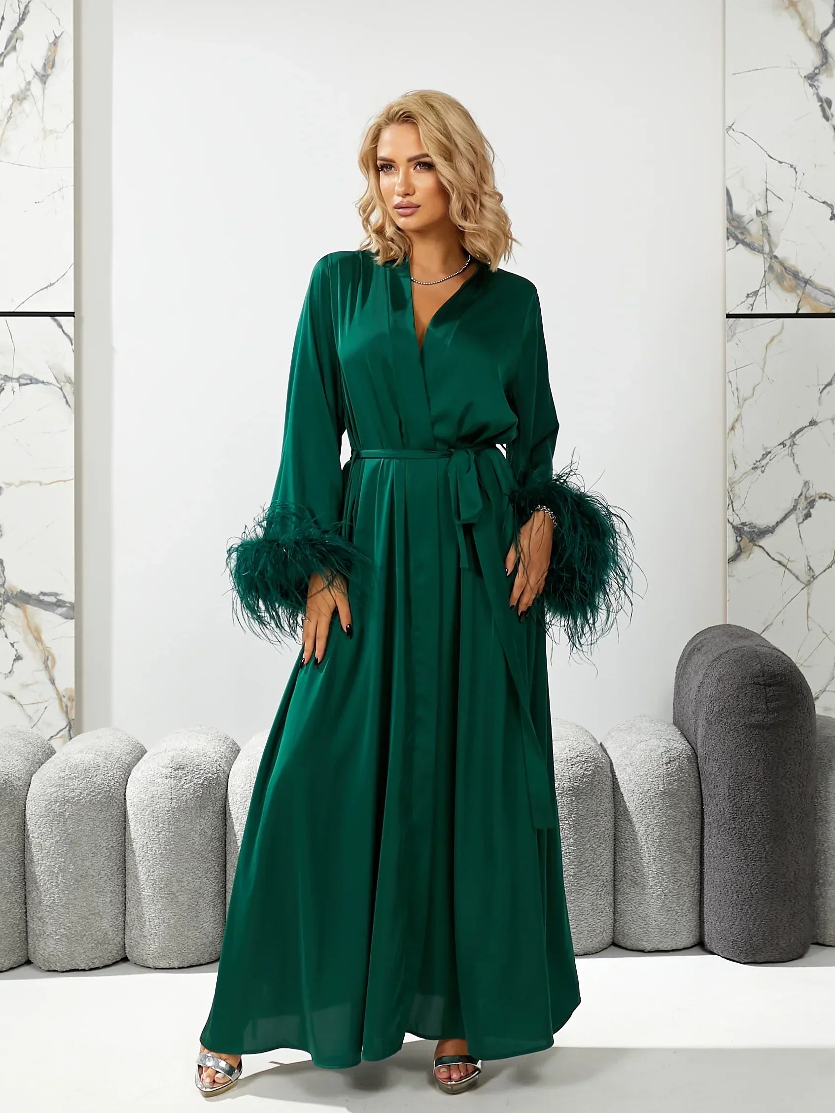 Emerald green silk bridal robe with feathered cuffs, perfect for wedding morning photos.