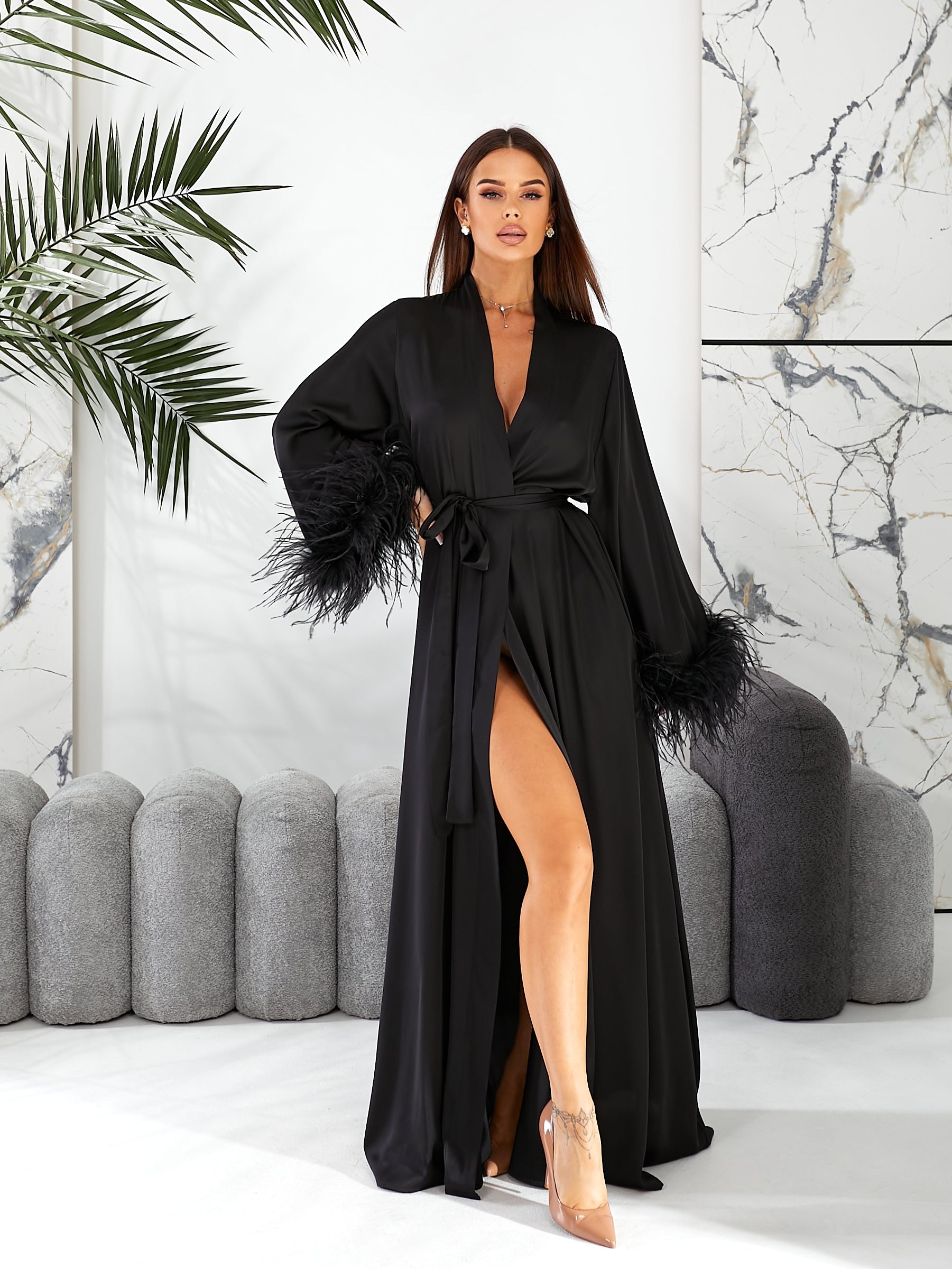 bridal robes, wedding morning robe, wedding gown, bridesmaid gift, long bridal feather robe   Woman wearing a black robe with feather details in an elegant interior setting.