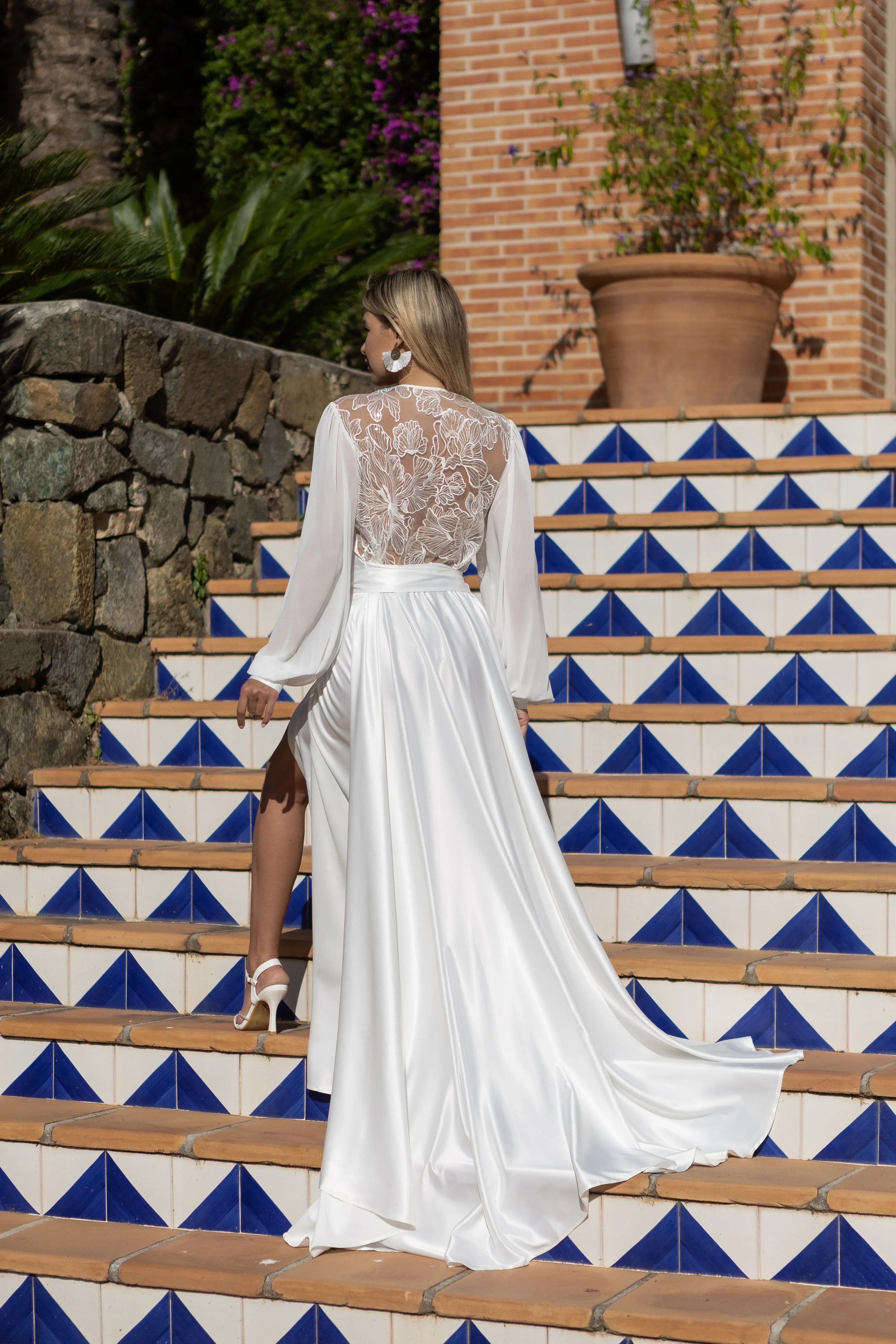 Bride in white silk bridal robe with sheer lace back, perfect for wedding morning