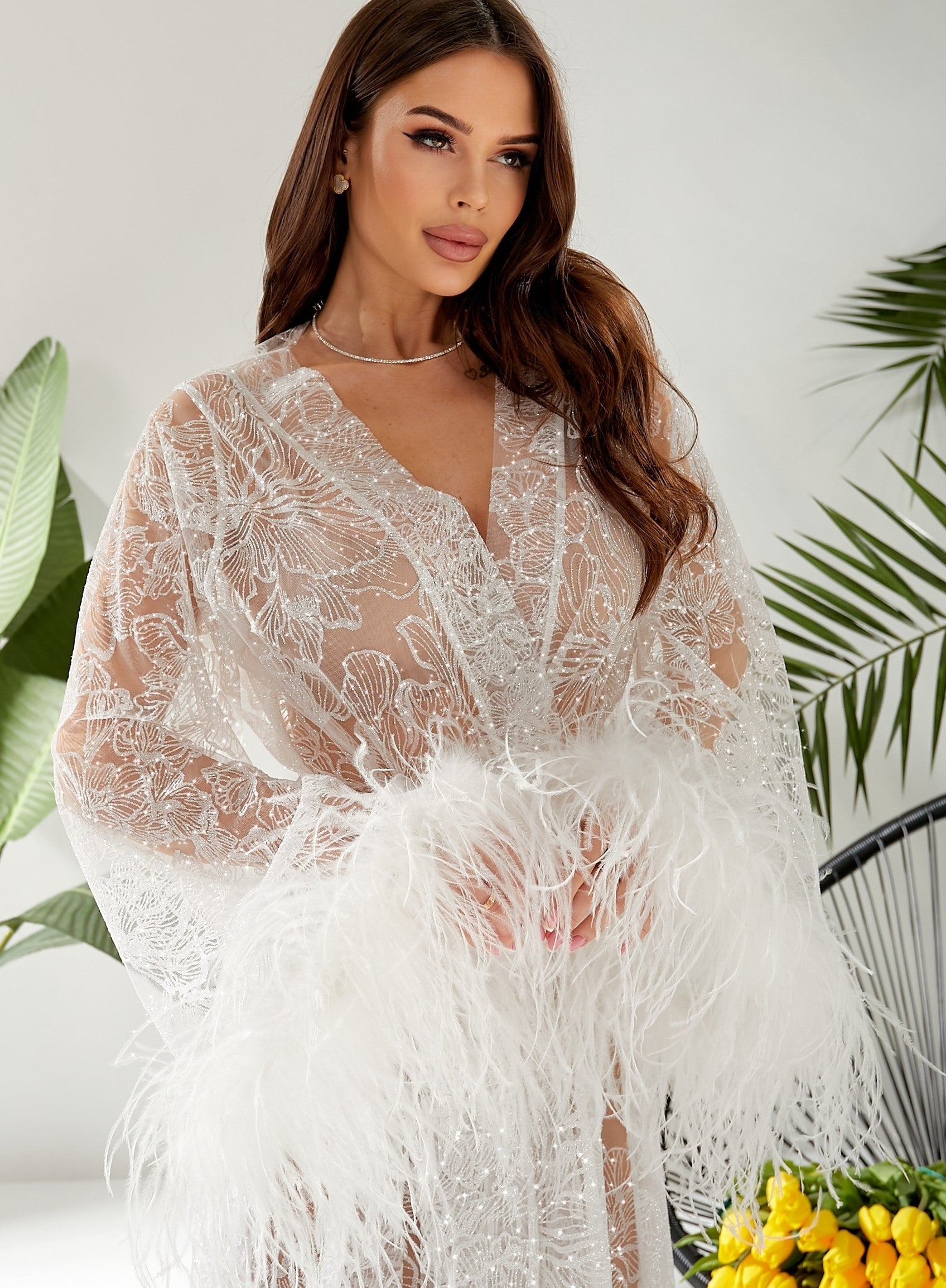 wedding robe, bridal robe ? feather robes, Luxury bride robe  Woman wearing a white lace dress with feather details against a white background